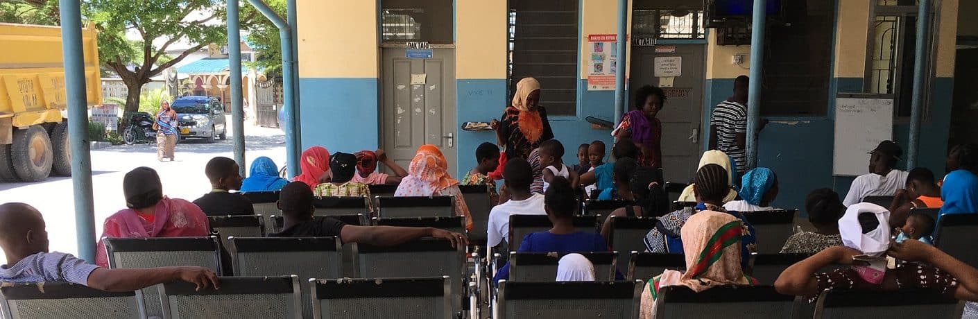 People sitting in a waiting room in a clinic in Tanzania
